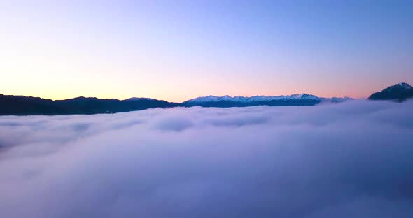 Flying Through Winter Clouds at beautiful Lake Hawea in New Zealand alt