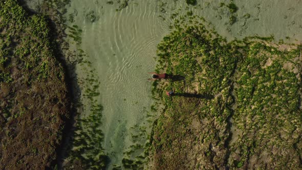 Top View Two Asian Boys Plays in Water on Beach alt