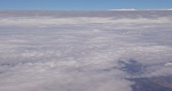 Aircraft View From Window on Clouds Blue Sky with Flying alt