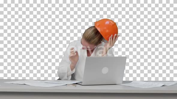 Tired young woman in safety helmet yawning, Alpha Channel