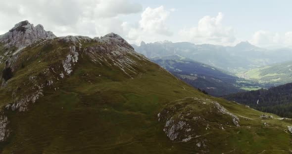 Aerial Drone Flight Establisher Over Green Cloudy Mountains Peaks alt