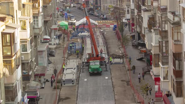 Unloading Concrete Plates From Truck By Crane at Road Construction Site Timelapse alt