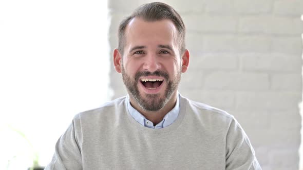 Portrait of Positive Young Architect Celebrating Success Joy alt