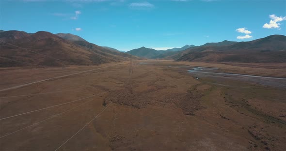 Drone Flying Alongside Power Lines Next to Clarence River New Zealand alt