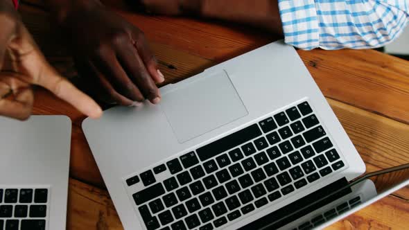 Man and woman using a laptop alt