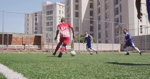 Soccer players having match on field alt