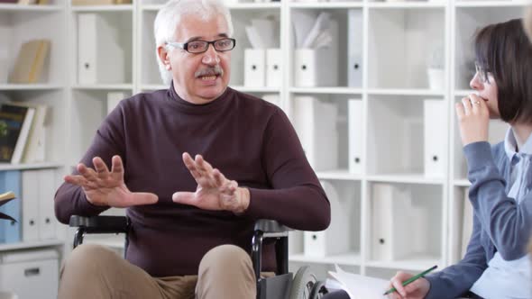 Disabled Mature Teacher Talking to Students alt