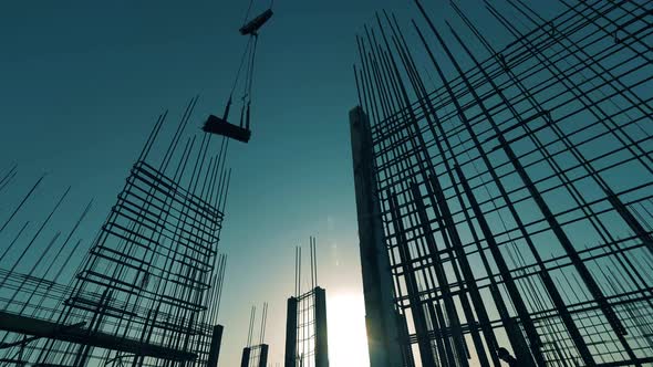 Construction Crane Moves Reinforcement Mesh. alt