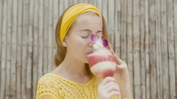 Portrait of Beautiful Woman on Vacation Enjoy Fruitshake alt