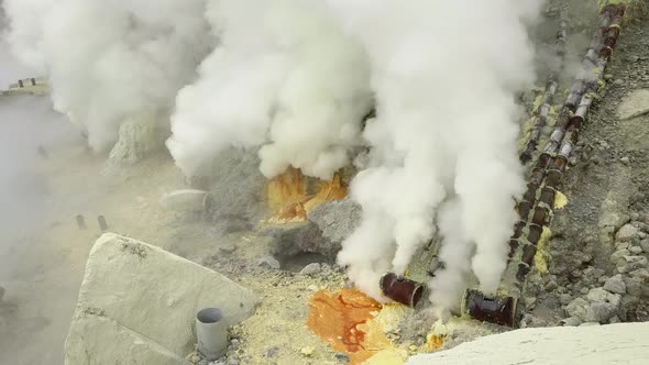 Sulfur Springs on the Lake in the Vent of a Sleeping Volcano Sulfur Smoke Comes Out From Under the alt