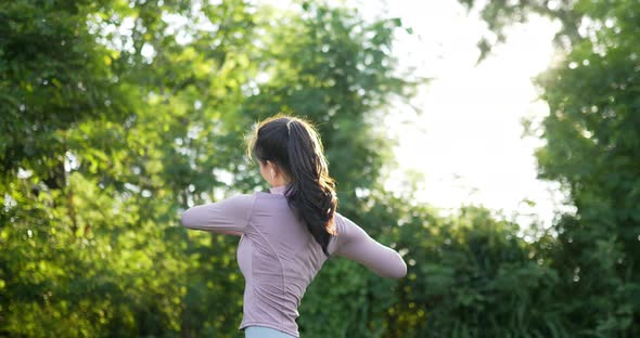 Woman warm up in the garden alt