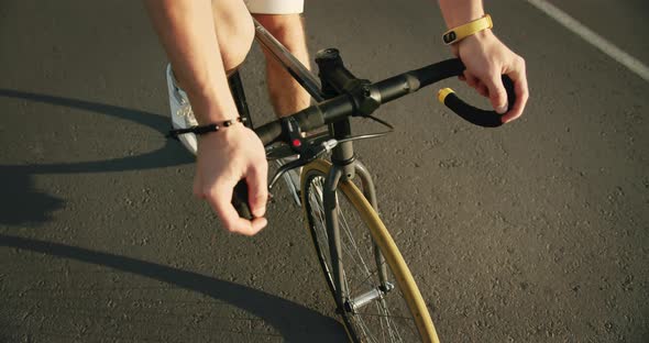 Top View of Male Riding Bike in Countryside