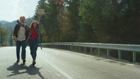 Couple Walk Forest Highway in Mountains alt
