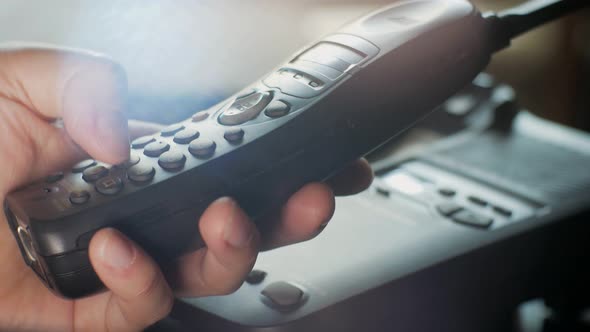 Male Hand Dials the Number on the Old Radiophone alt