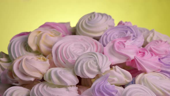 Swirls of Sweet Meringue Rotating on Yellow Background alt