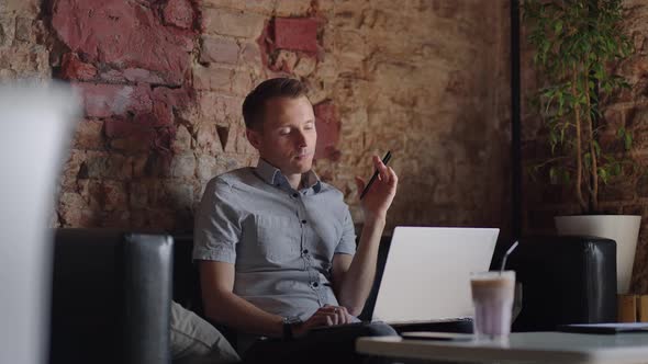 Thoughtful Serious Young Man Student Writer Sit at Home Office Desk with Laptop Thinking of alt