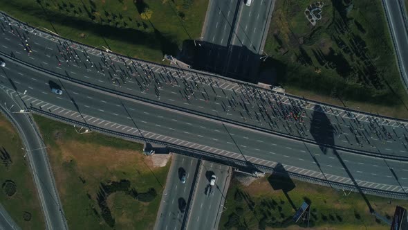 Aerial Drone Footage. Top Circular View Marathon Running on the Road Junction, Close Up alt