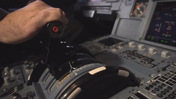 The Cockpit of the Aircraft. The Pilot Adjusts the Autopilot alt