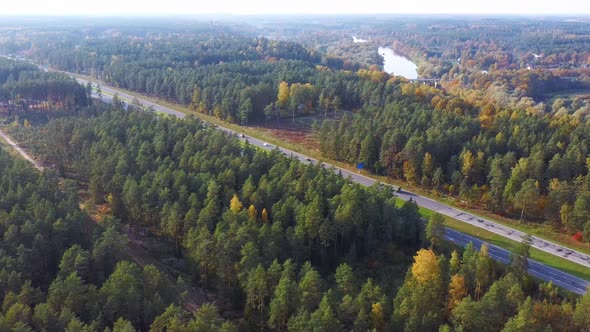 Latvia, A2 Highway Autumn Landscape From Above. Gauja River With Bridge and Ramkalni in Background. alt