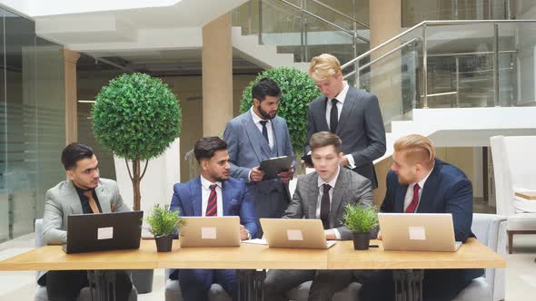 Multicultural Business Partners Meeting Discussing, Using Laptop, Modern Technologies alt