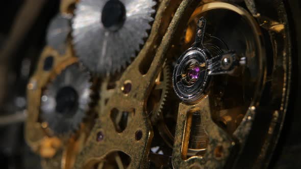 Moving Metal Gears Inside Working Watch Mechanism. Close Up alt