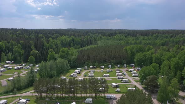 Beautiful Aerial Shot of a Caravan Park in the Middle of a Forest