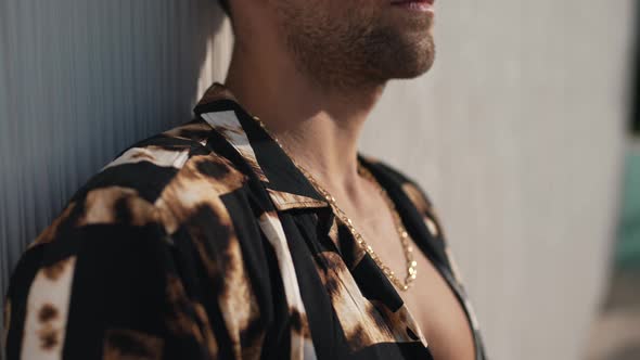 Guy in a Hawaiian Shirt with a Gold Pendant alt