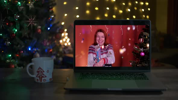 Woman Blowing Up Confetti Firecracker on Videocall alt