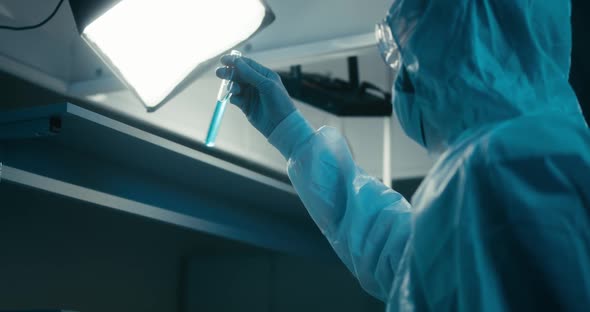 Scientist Examining Sample in Laboratory alt