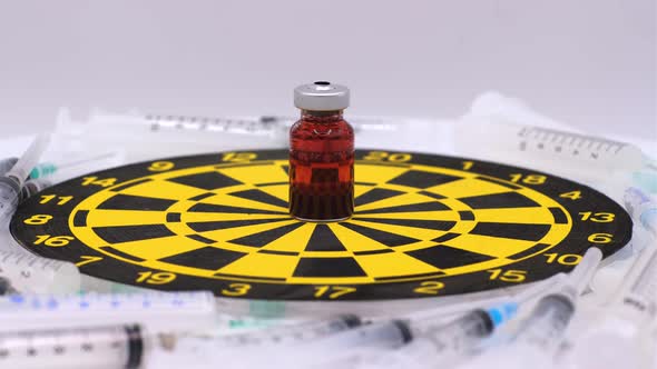 Vaccine bottle with red solution with syringe alt