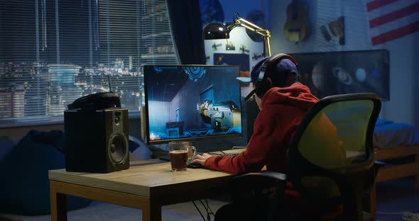 Boy Playing with a Video Game alt