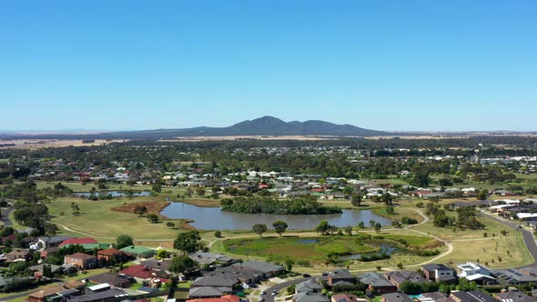 AERIAL Push In Of Lara Lake And You Yang Mountain Ranges, Australia alt