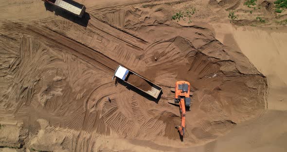Excavator Loads Sand