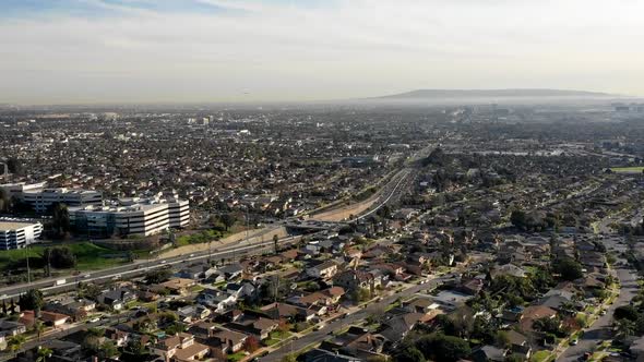Moving aerial timelapse approaching a highway in Los Angeles alt