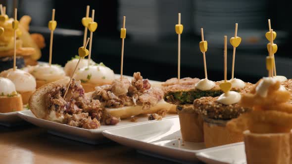 Showcase Window Display Assortiment with Tapas – Traditional Spanish Sandwiches Starters in a Cafe alt