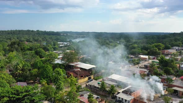 Aerial - Impoverished indigenous slum near the city of Manaus, Brazil. Wide shot, pull back. alt