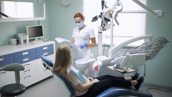 Health and Dental Care Woman at Work As Dentist and Doctor Meeting with Assistant and Talking with