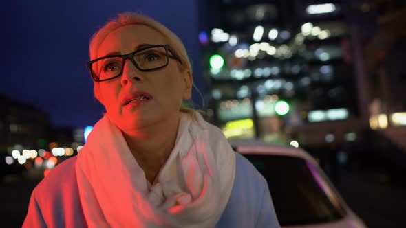 Nervous Woman Standing Near Her Car and Waiting for Tow Truck, Car Accident