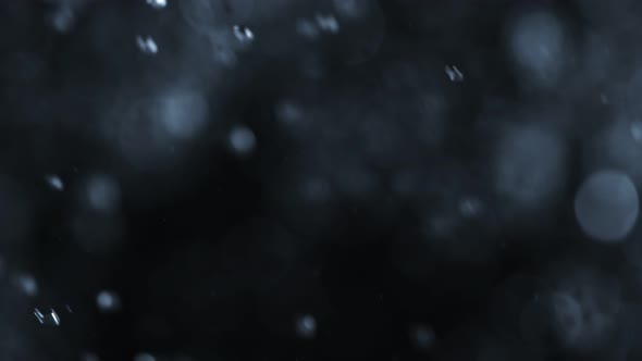 Super Slow Motion Abstract Shot of Water Rain at 1000Fps Isolated on Black Background. alt