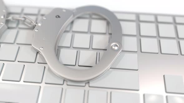 Handcuffs on Keyboard with PORN Text on Keys alt