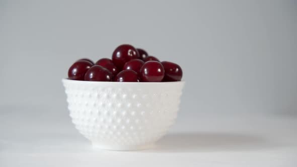 A Cup with Dark Red Large Cherries