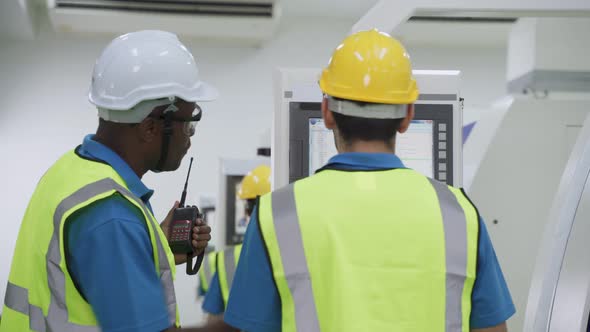 Group of diversity worker people wearing protective safety helmet and glasses in industry factory. alt