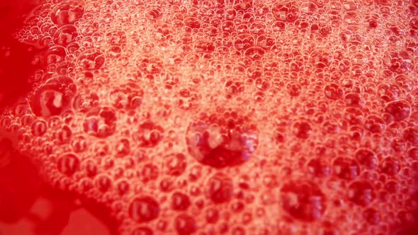 Pouring and splashing the juice of Sicilian oranges. Slow motion. alt