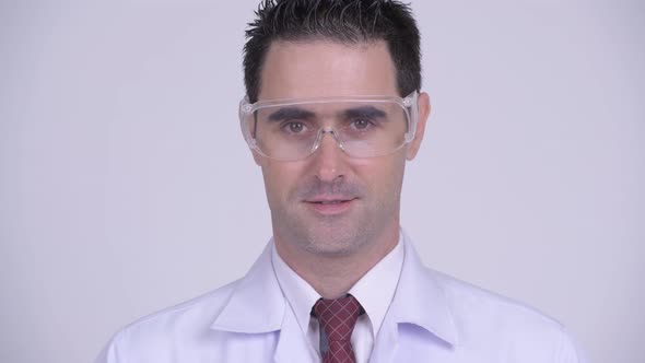Face of Happy Handsome Man Doctor Smiling and Wearing Protective Glasses alt