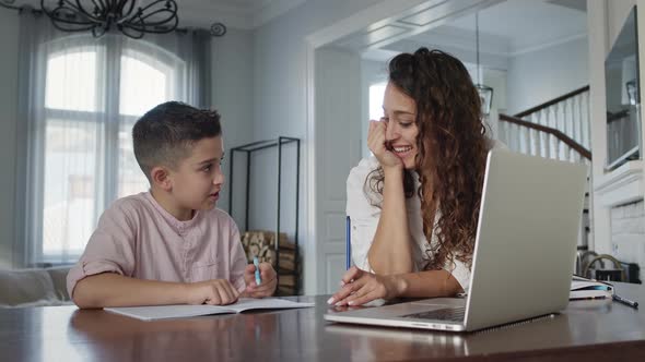 Young Mother And Son At The Table alt