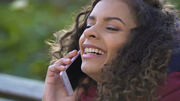 Young Attractive Female Talking With Her Friend Over Mobile Phone, Closeup alt