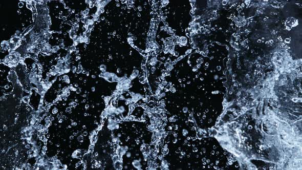 Super Slow Motion Shot of Side Water Splash Isolated on Black Background at 1000Fps alt