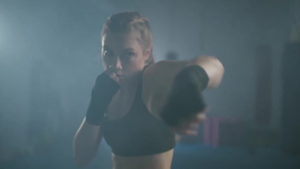 Young Woman Fighter Trains His Punches Training in the Boxing Gym Female Trains a Series of Punches alt