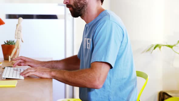 Male volunteer working on computer alt