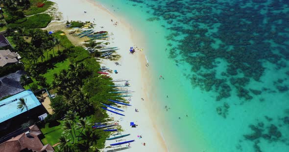 Bird's Eye View Of Waves And Sand Over A Cay With Turquoise Waters